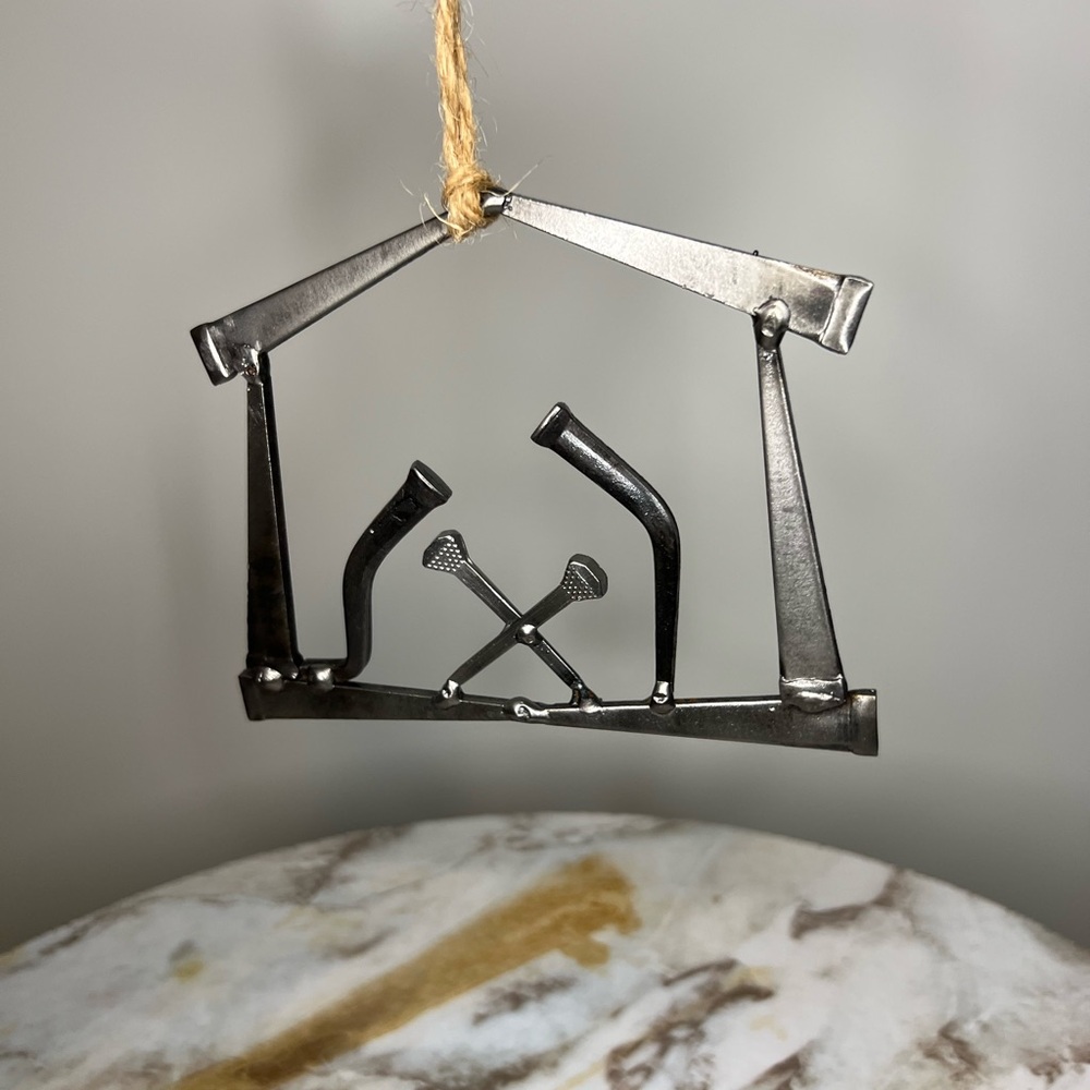 Metal nativity scene manger ornament made from tools